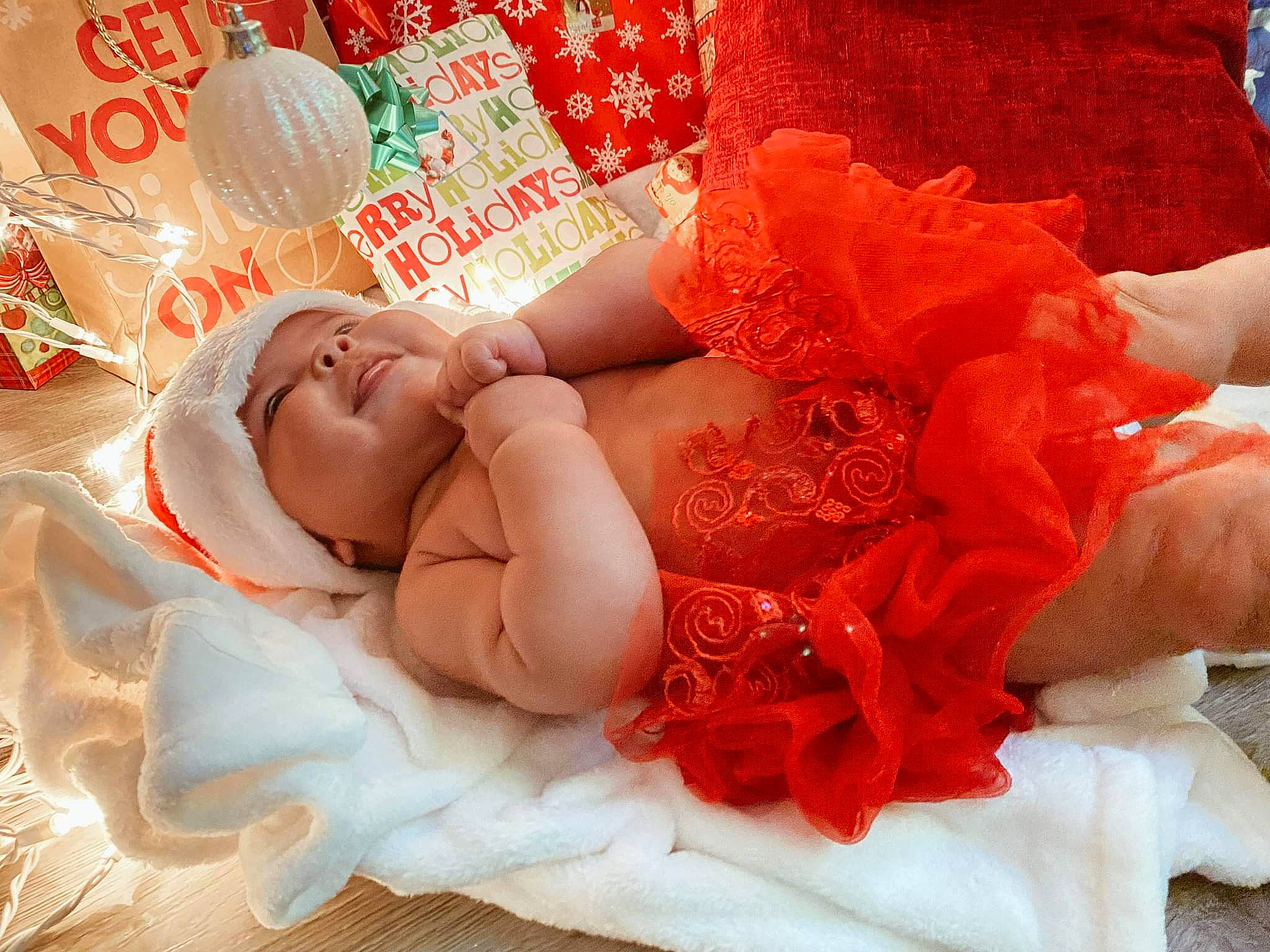 Stevie is registered to the contest to win money with this photo: child, comfort, dress, embellishment, event, finger, glasses, happy, hat, headpiece, human_body, human_leg, jewellery, nail, peach, person, petal, pink, skin, textile