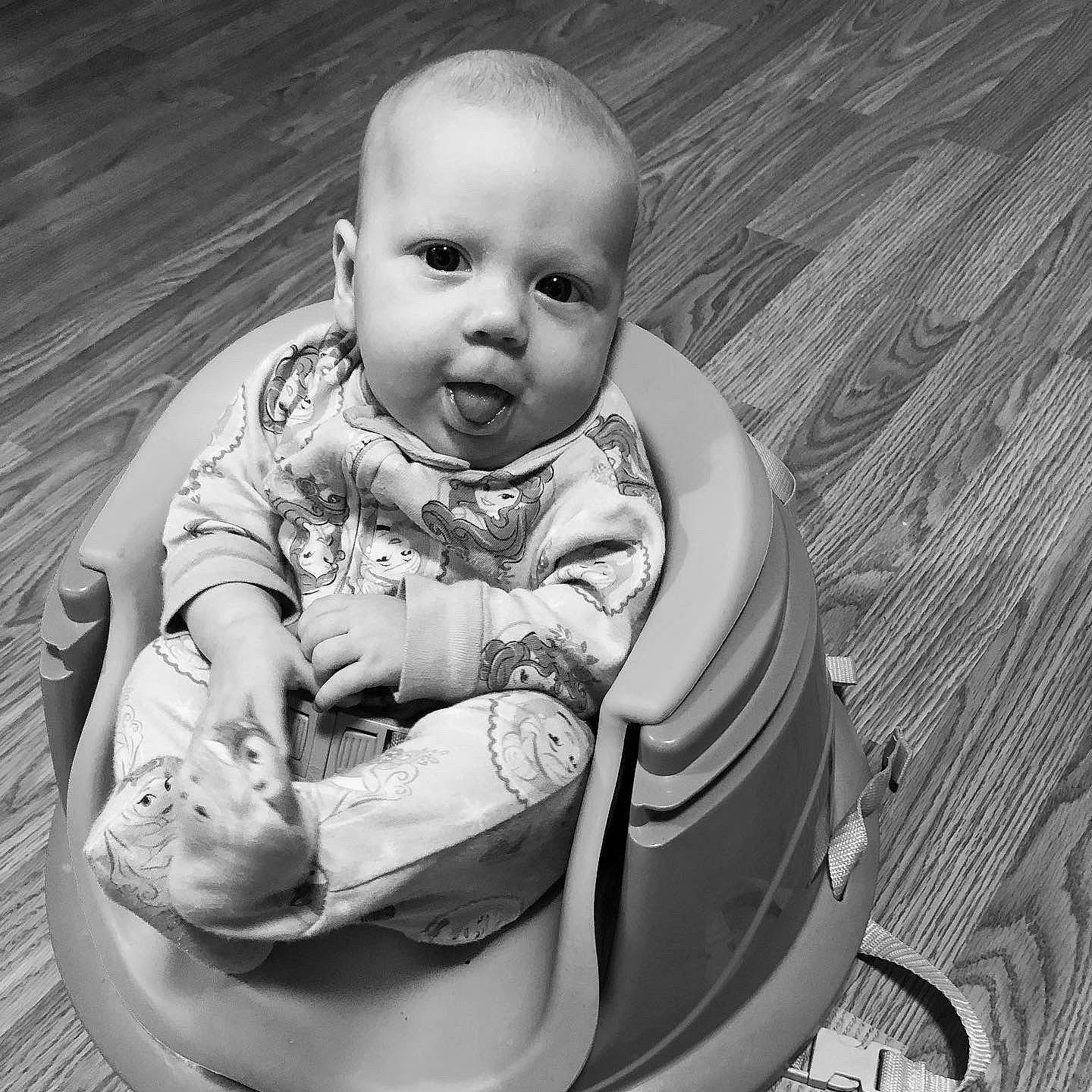 Joy is registered to the contest to win money with this photo: baby, baby_products, black_and_white, cheek, child, monochrome, monochrome_photography, person, photography, product, sitting, skin, smile, stock_photography, style, toddler