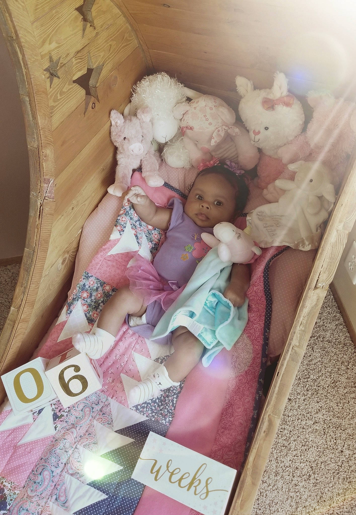 Emerie joined the competition — help win amazing prizes! baby_products, bed, bedtime, child, doll, girl, infant, infant_bed, person, pink, product, skin, textile, toddler, toy