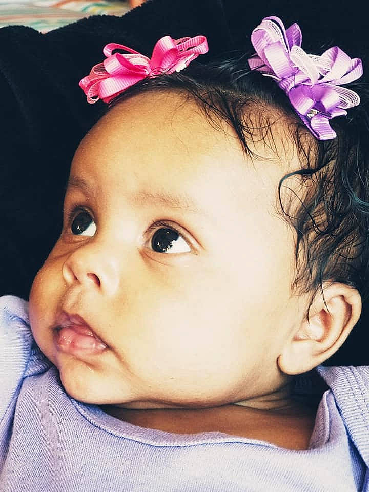 Emerie is registered to the contest to win money with this photo: beauty, cheek, child, child_model, ear, eye, eyebrow, flower, forehead, girl, hair_accessory, head, headband, headpiece, infant, lip, person, pink, skin, smile