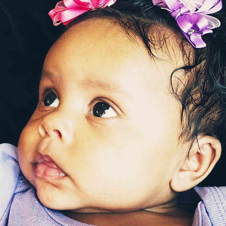 Emerie is registered to the contest to win money with this photo: beauty, cheek, child, child_model, ear, eye, eyebrow, flower, forehead, girl, hair_accessory, head, headband, headpiece, infant, lip, person, pink, skin, smile