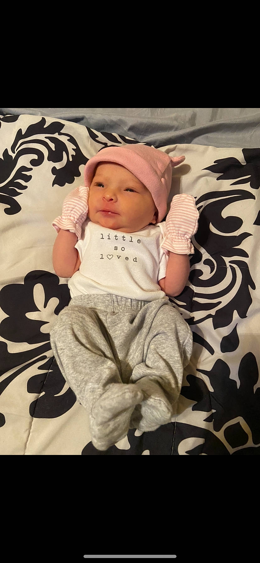 Rhaelynn is registered to the contest to win money with this photo: arm, art, baby, baby_toddler_clothing, cap, cheek, child, comfort, flooring, happy, headwear, human_body, illustration, linens, pattern, person, sitting, sleeve, stock_photography, textile