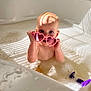 Analiese is registered to the contest to win money with this photo: baby, bathtub, bubbles, child, foam, heart_shaped_glasses, indoor, light_and_shadow, person, pink_glasses, playful, portrait, skin, water, young_child, toddler, cute, bath_time, fun, sunlight