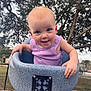 toddler, child, swing, playground, outdoor, tree, happy, smiling, purple_clothing, sitting, play, daylight, baby, fun, park, metal_chain, blue_swing, person, cute, face