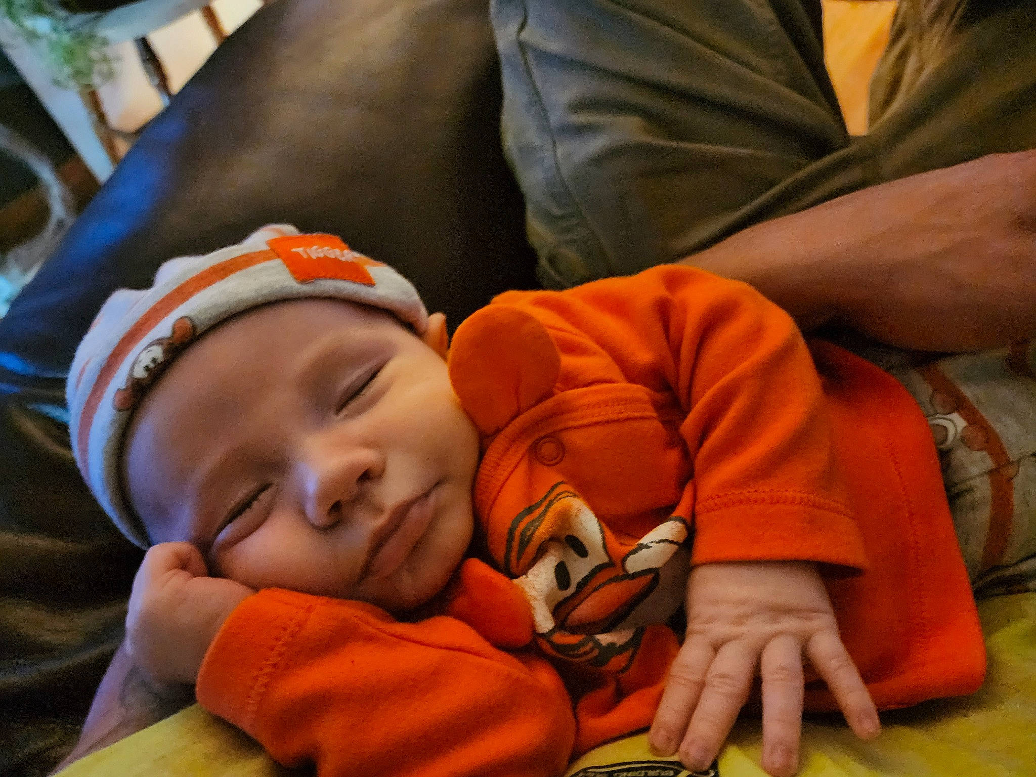 Colton is registered to the contest to win money with this photo: baby, baby_products, baby_sleeping, baby_toddler_clothing, bedtime, cheek, child, comfort, elbow, finger, happy, headwear, mammal, nap, nose, orange, person, room, sitting, smile