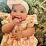 Kinsley is registered to the contest to win money with this photo: apparel, baby, cheeks, child, couch, cute, dress, face, floral, hand, happy, headband, indoors, infant, pattern, person, portrait, sitting, skin, smile