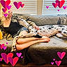 Huckleberry Hound is registered to the contest to win money with this photo: woman, dog, couch, indoor, window, blonde_hair, shorts, black_top, blanket, heart_graphics, relaxing, pet, human_dog_interaction, love, affection, legs, barefoot, long_dog, spotted_dog, casual