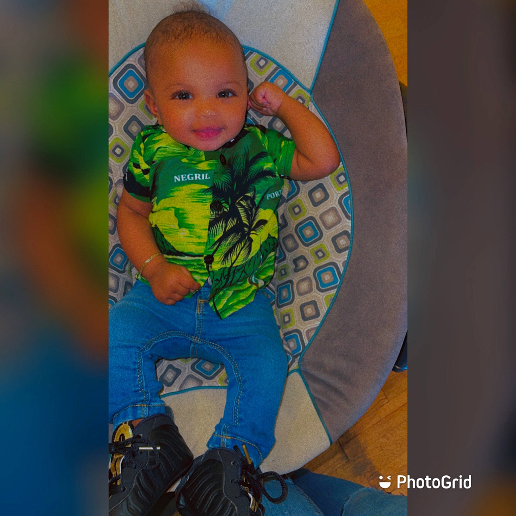 Kace is registered to the contest to win money with this photo: arm, azure, baby, baby_products, baby_toddler_clothing, cool, denim, electric_blue, flash_photography, font, fun, happy, joy, leisure, pattern, person, sitting, sleeve, smile, t_shirt