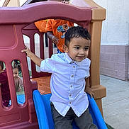 Damian Politz is registered to the contest to win money with this photo: building_wall, casual_clothing, child, concrete, curly_hair, daylight, door, fun, group, happy, kids, outdoor, plastic_play_structure, play, playground, short_hair, slide, smiling, toddler, white_shirt
