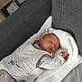 Louis a rejoint le concours — aidez-le/la à gagner de superbes lots ! baby, infant, sleeping, blanket, pacifier, couch, white, grey, soft, peaceful, indoors, clothing, rest, cozy, child, face, head, small, cute, relaxation