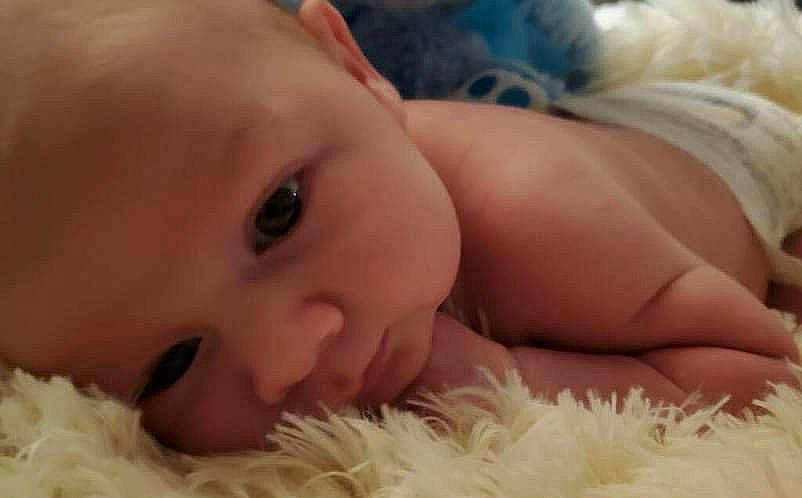 Christopher is registered to the contest to win money with this photo: baby, cheek, comfort, eyebrow, eyelash, finger, hand, happy, human, human_body, iris, lip, mammal, mouth, nose, organ, person, skin, textile, toddler