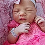 accessories, baby, bodypart, bonnet, bracelet, clothing, dress, face, glove, hat, head, jewelry, newborn, person, photography, portrait, purple, quilt, ring, sleeping