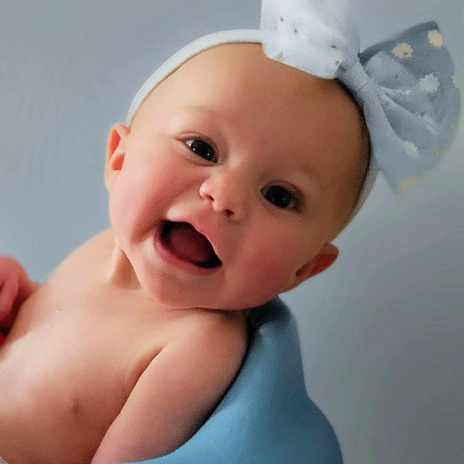 Bellomy joined the competition — help win amazing prizes! baby, infant, smile, headband, bow, child, face, happy, cute, skin, blue, seat, portrait, young, cheerful, expression, indoor, head, person, closeup