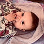 Elèna a rejoint le concours — aidez-le/la à gagner de superbes lots ! baby, blanket, blue_eyes, child, clothing, comfort, curly_hair, cute, cute_expression, face, floral_pattern, hand, indoors, infant, lying_down, portrait, relaxing, skin, soft_texture, young_child