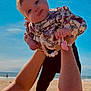 Elèna participe au concours pour gagner de l'argent avec cette photo : arms, baby, beach, child, cute, floral_clothing, happy, holding, infant, nature, ocean, outdoor, pacifier, person, playful, portrait, sky, summer, sunlight, vacation