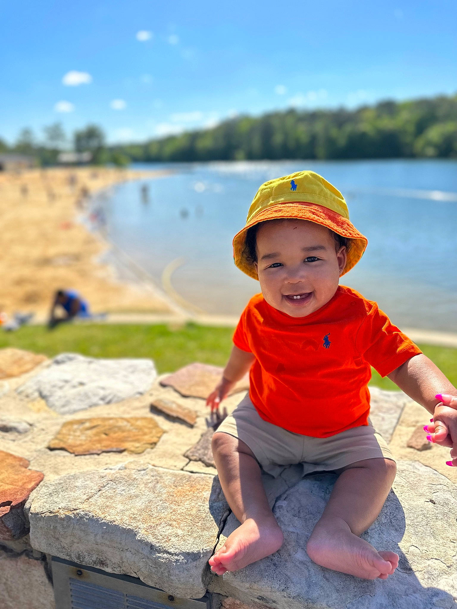 Kyng is registered to the contest to win money with this photo: baseball_cap, beach, cap, cloud, fun, happy, hat, headwear, lake, landscape, leisure, people_in_nature, person, photograph, plant, shorts, sky, summer, toddler, travel