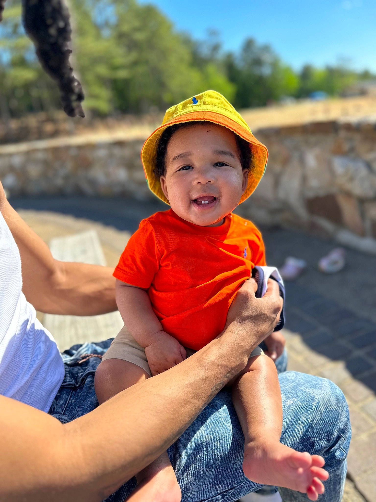 Kyng joined the competition — help win amazing prizes! baby, baby_toddler_clothing, cap, child, electric_blue, facial_expression, fun, grass, happy, hat, headwear, human_leg, leisure, person, recreation, sitting, sky, sun_hat, thigh, toddler
