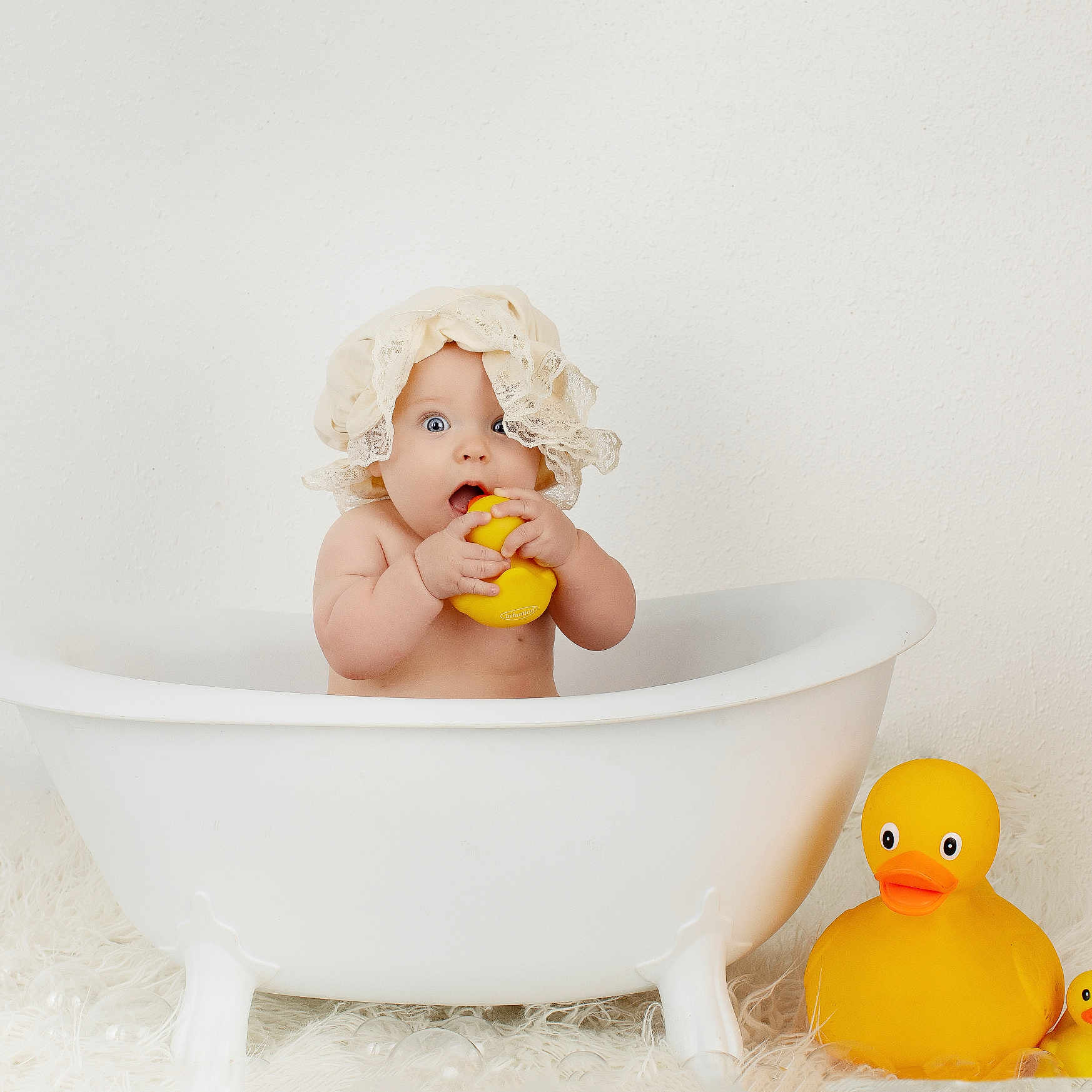 Sloane is registered to the contest to win money with this photo: baby, bathing, bathtub, bowl, doll, eating, face, figurine, food, head, hottub, person, photography, plush, portrait, toy, tub