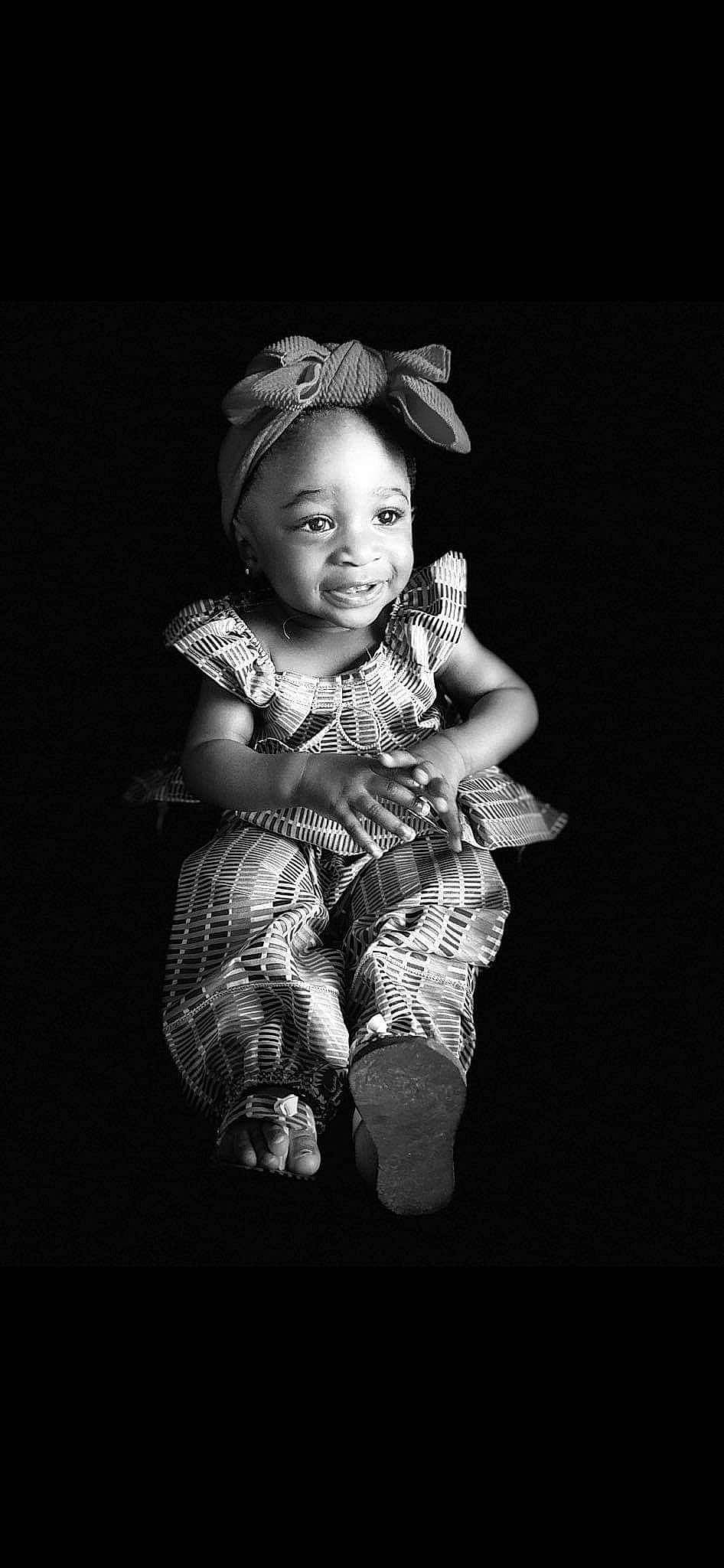 Maloni is registered to the contest to win money with this photo: art, baby, baby_toddler_clothing, darkness, elbow, fashion_accessory, flash_photography, fun, gesture, happy, headgear, headpiece, iris, jewellery, joy, monochrome, monochrome_photography, person, sitting, sleeve