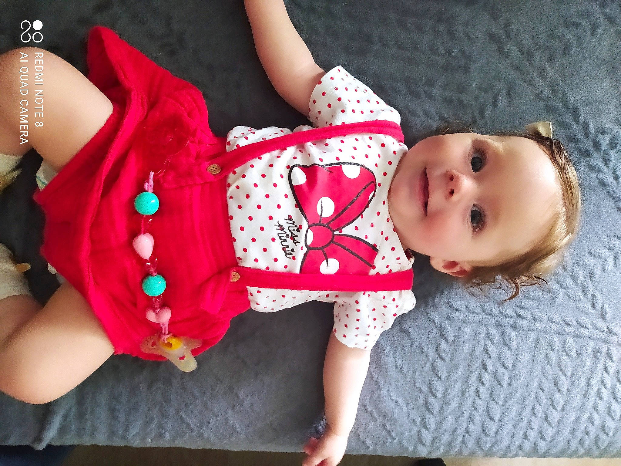 Léandra participe au concours pour gagner de l'argent avec cette photo : baby, baby_toddler_clothing, child, doll, finger, headgear, human_body, joint, joy, leg, lip, pattern, person, pink, red, skin, sleeve, textile, thigh, toddler