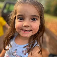 Hazel is registered to the contest to win money with this photo: background_blur, brown_hair, butterfly, casual_clothing, child, childhood, closeup, cute, daylight, eyes, face, girl, happy, nature, outdoor, person, portrait, smiling, tank_top, young