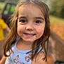 background_blur, brown_hair, butterfly, casual_clothing, child, childhood, closeup, cute, daylight, eyes, face, girl, happy, nature, outdoor, person, portrait, smiling, tank_top, young