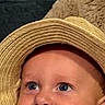 baby, blanket, blue_eyes, child, clothing, cozy, cushion, cute, face, happy, hat, headwear, indoor, infant, person, portrait, smiling, straw_hat, white_shirt, young