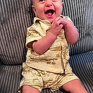 Holden joined the competition — help win amazing prizes! baby, child, clothing, couch, cute, fabric, face, hands, happy, head, indoors, infant, laughing, patterned_outfit, person, portrait, sitting, smiling, texture, young_child