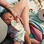 arm, baby, bed, blanket, bottle, care, clothing, comfort, feeding, holding, indoor, infant, leg, newborn, pacifier, person, resting, skin, soft, tattoo