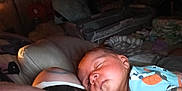 Desian is registered to the contest to win money with this photo: baby, sleeping, infant, person, clothing, indoor, blanket, bedroom, fan, diapers, soft, rest, comfort, closeup, young_child, peaceful, skin, head, cute, quiet