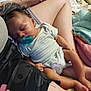 Desian is registered to the contest to win money with this photo: baby, sleeping, pacifier, infant, tattoo, person, lap, blanket, clothing, skin, arm, leg, comfort, rest, indoor, closeup, casual, relaxation, child, cute