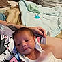 Desian is registered to the contest to win money with this photo: baby, newborn, infant, person, arm, blanket, pacifier, bed, indoor, resting, clothing, tattoo, comfort, care, soft, sleepy, family, relaxation, closeup, toddler