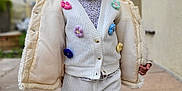Eleysa participe au concours pour gagner de l'argent avec cette photo : toddler, child, outdoor, clothing, knitwear, flower, jacket, pants, person, standing, smiling, cute, happy, portrait, hair, pigtails, sidewalk, house, sky, daylight