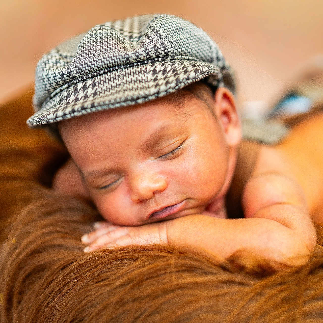 Raam is registered to the contest to win money with this photo: baby, sleeping, cap, houndstooth, fur, brown, soft, portrait, closeup, peaceful, child, resting, face, headwear, infant, cozy, warm, skin, cute, relax