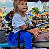 Alexa joined the competition — help win amazing prizes! amusement_park, blue_pants, child, colorful, daytime, entertainment, family, fun, girl, handlebar, happy, leisure, outdoor, playful, pony_tail, ride, seat, smile, white_shirt, young
