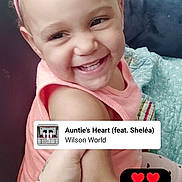 Kamoni is registered to the contest to win money with this photo: toddler, child, smiling, headband, pink, bow, couch, blanket, happy, baby, indoor, portrait, cute, person, music_overlay, social_media, hand, sitting, light, skin