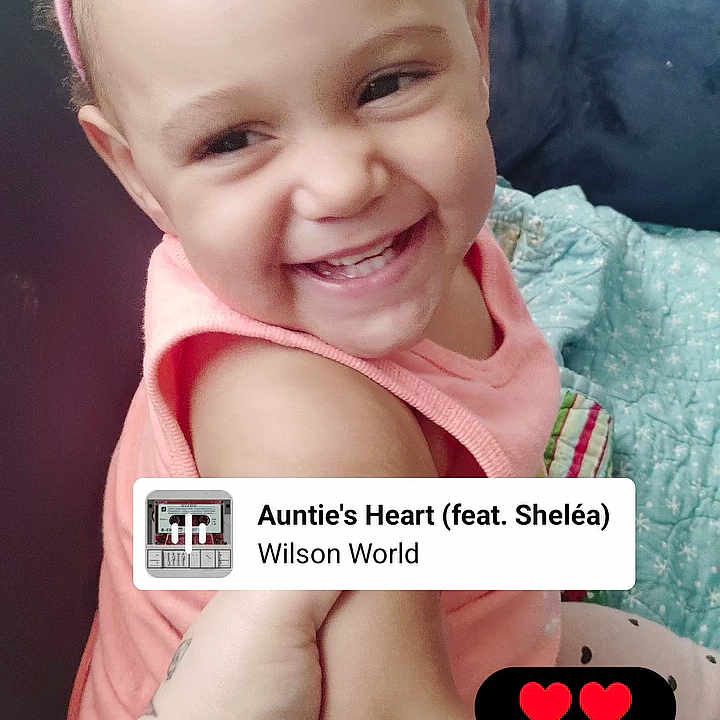 Kamoni is registered to the contest to win money with this photo: toddler, child, smiling, headband, pink, bow, couch, blanket, happy, baby, indoor, portrait, cute, person, music_overlay, social_media, hand, sitting, light, skin