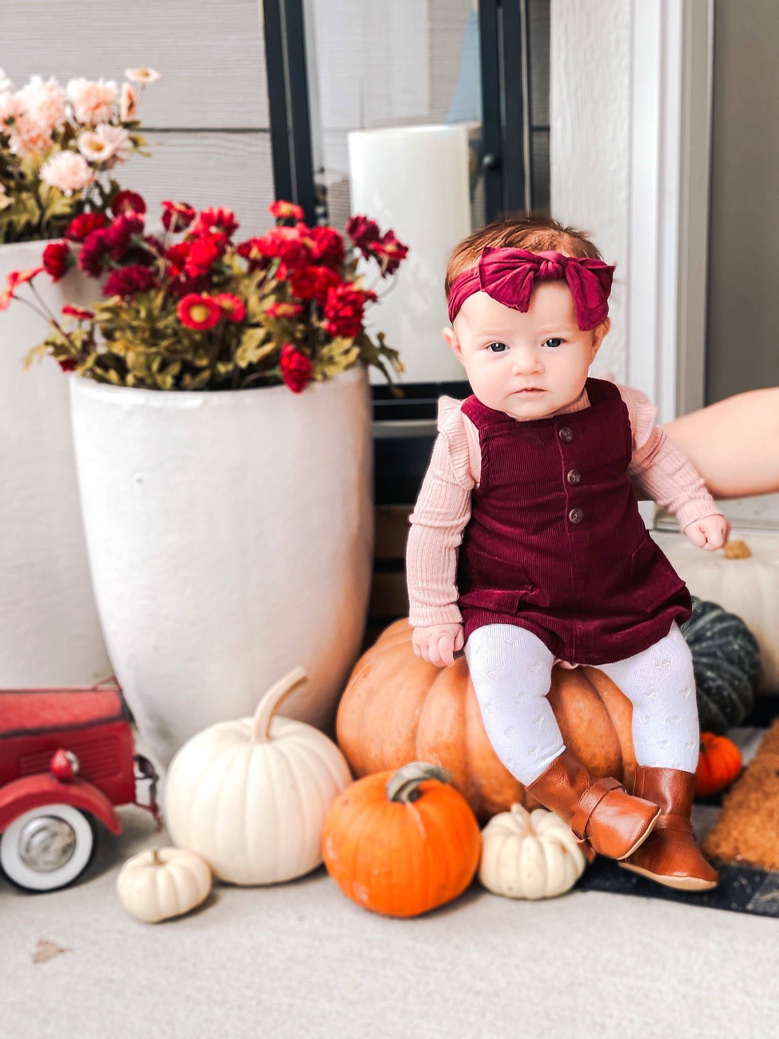 Macy is registered to the contest to win money with this photo: calabaza, cucurbita, dress, flooring, flower, flower_arranging, flowerpot, gourd, hat, houseplant, natural_foods, orange, person, photograph, plant, pumpkin, squash, toy, vegetable, white