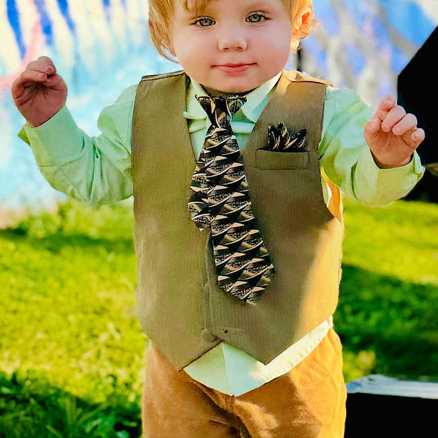 Gavin is registered to the contest to win money with this photo: accessories, bodypart, boy, child, clothing, coat, costume, face, finger, formalwear, hand, head, jacket, male, pants, person, photography, portrait, tie, vest