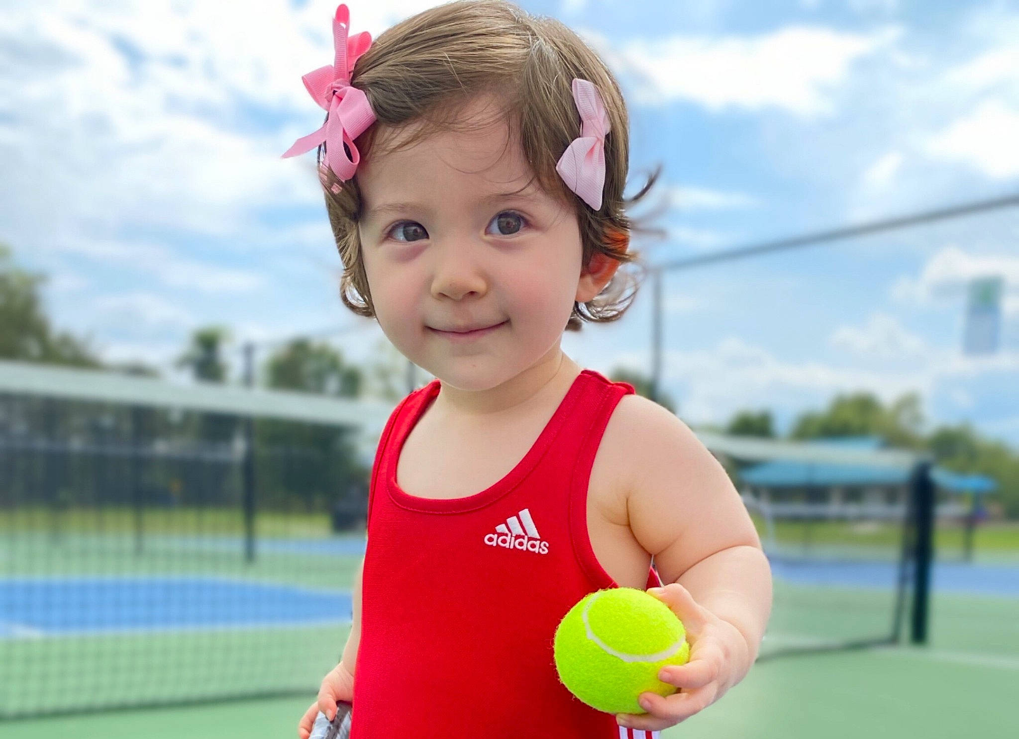 Lily joined the competition — help win amazing prizes! athlete, ball, ball_game, child, cloud, face, fun, grass, happy, joy, leisure, net_sports, person, player, playing_sports, racquet_sport, recreation, sky, smile, sports_equipment