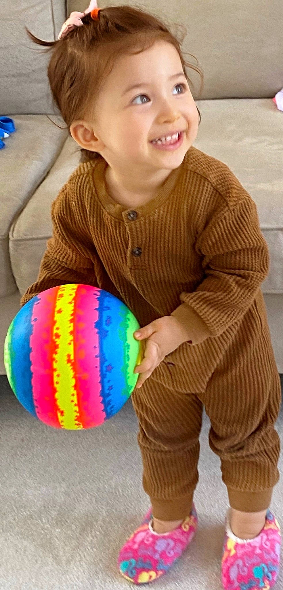 Lily joined the competition — help win amazing prizes! baby, baby_playing_with_toys, baby_toddler_clothing, ball, balloon, child, facial_expression, fun, happy, joy, outerwear, pattern, person, product, sitting, sleeve, smile, sports_toy, t_shirt, textile