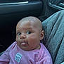 baby, infant, child, tongue_out, pink_clothing, striped_shirt, car_interior, seat, person, cute, face, head, eyes, expression, sitting, lap, young_child, skin, human, casual
