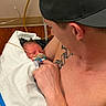 Emersyn joined the competition — help win amazing prizes! baby, baseball_cap, blanket, caregiving, close_up, family, father, hospital, indoor, infant, medical_tubing, newborn, pacifier, parent, pepsi_wristband, portrait, skin_to_skin, sleeping, swaddled, tattoo