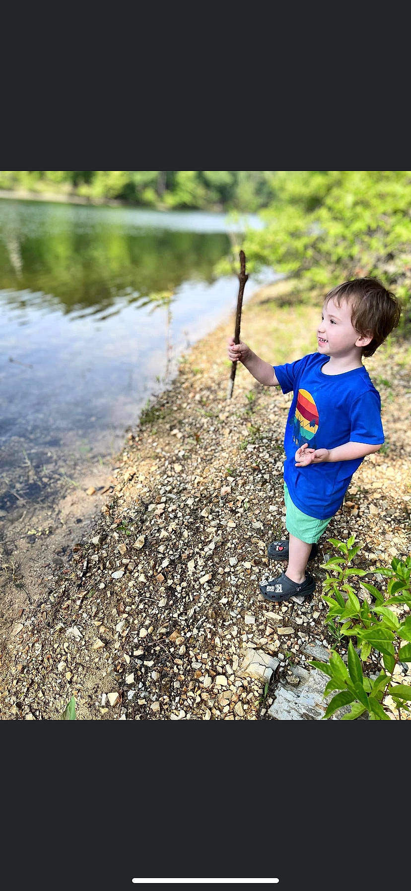 Kent is registered to the contest to win money with this photo: angling, casting_fishing, electric_blue, fishing_rod, forest, grass, happy, lake, landscape, leisure, natural_landscape, people_in_nature, person, plant, recreation, recreational_fishing, shorts, sunlight, toddler, water