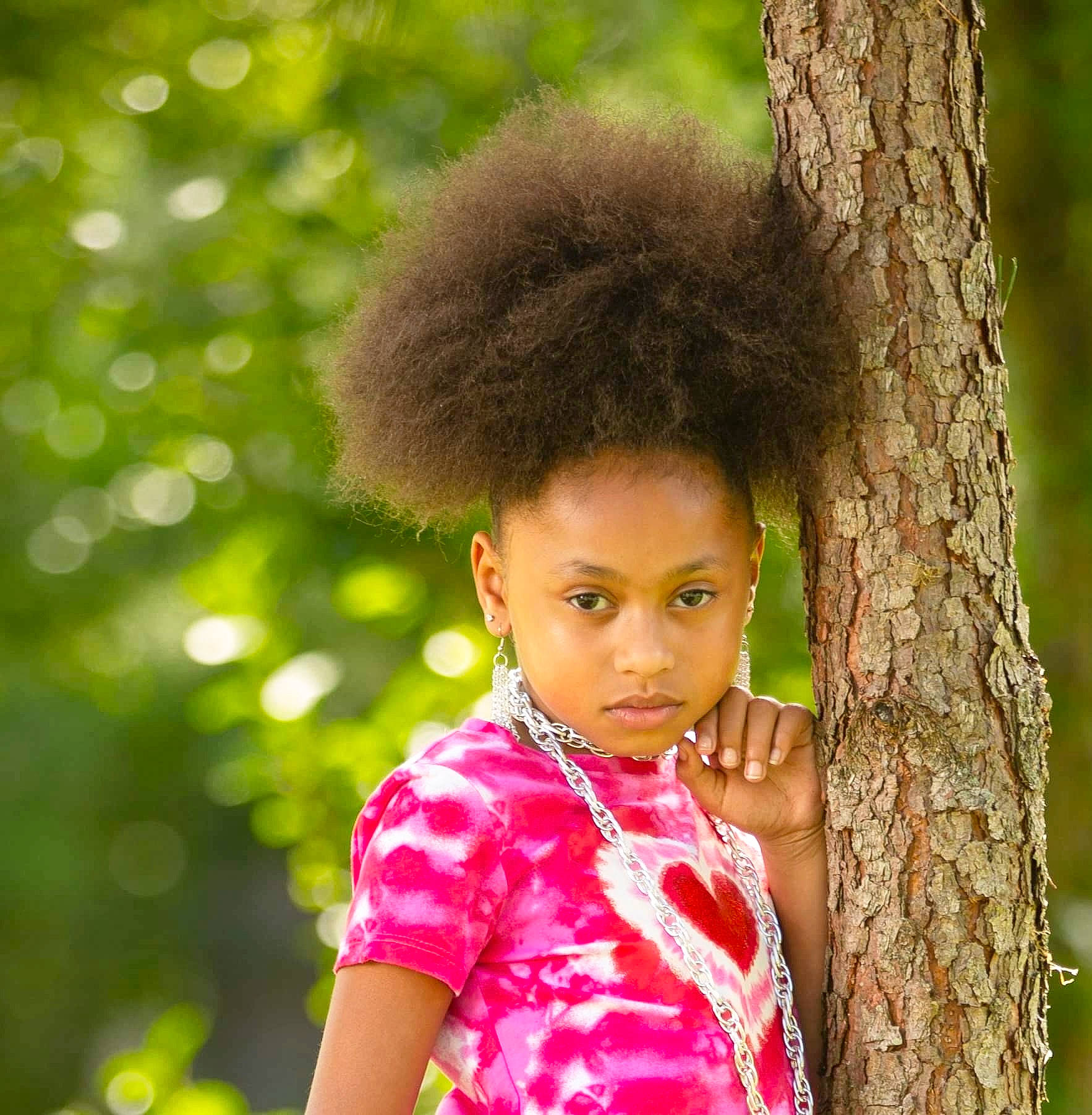 Kimorah is registered to the contest to win money with this photo: adaptation, afro, beauty, black_hair, child, eye, face, forest, fun, fur, grass, hair, happy, head, leisure, people_in_nature, person, portrait_photography, toddler, tree