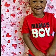 Maverick joined the competition — help win amazing prizes! background_pattern, boy, child, clothing, cute, gap_tooth, hands, happy, hearts, indoors, looking_at_camera, love, party, portrait, red, red_shirt, short_hair, smiling, toddler, valentines_backdrop