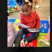 Miracle joined the competition — help win amazing prizes! toddler, child, reading, cards, colorful_mat, hair_bows, indoor, playroom, toys, jeans, sneakers, red_shirt, floor, playtime, learning, kids, education, young_child, cute, concentration