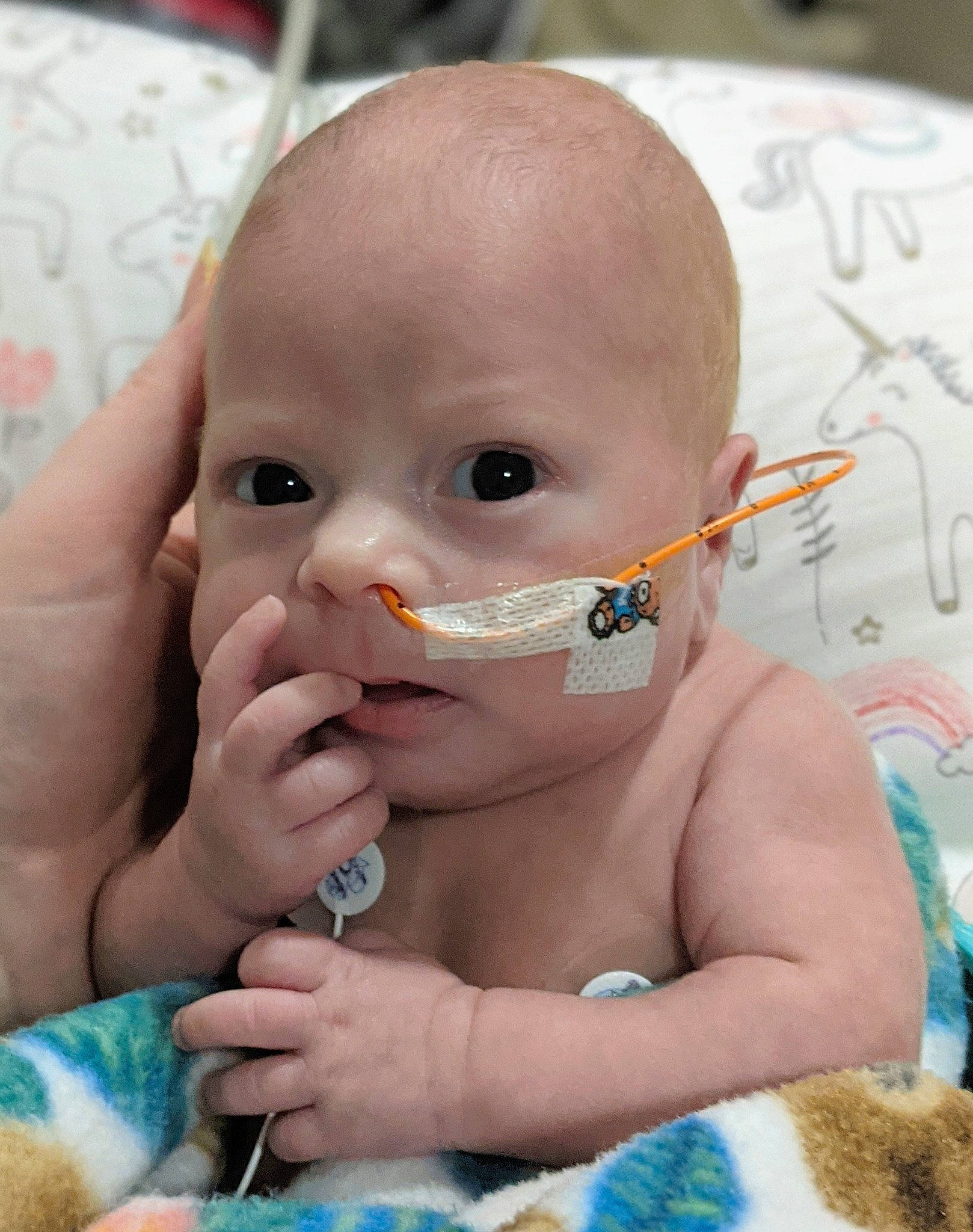 Maelynn joined the competition — help win amazing prizes! baby, baby_toddler_clothing, blue, cheek, chin, drinkware, ear, eyebrow, eyelash, face, finger, forehead, gesture, hand, iris, lip, mouth, neck, nose, person