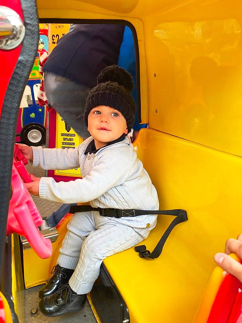 Benny is registered to the contest to win money with this photo: car, child, family_car, fun, motor_vehicle, person, play, toddler, vehicle, yellow