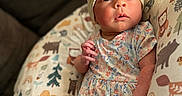 Amelia joined the competition — help win amazing prizes! animal_print, baby, bow_headband, child, comfort, cozy, curious_expression, cushion, cute, floral_dress, indoors, infant, lying_down, newborn, person, portrait, small_hands, soft_lighting, tender, woodland_animals